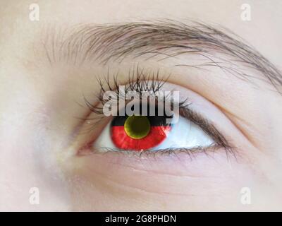 Portrait of a young girl with the color of the eyes of the flag of Australian Aboriginal Stock Photo