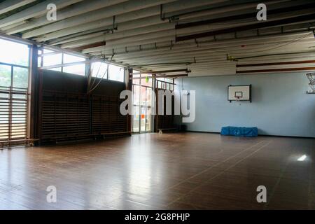 an empty classic wooden style gymnasium in an english secondary school in london england UK Stock Photo