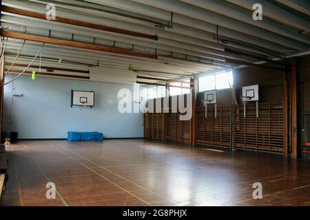 an empty classic wooden style gymnasium in an english secondary school in london england UK Stock Photo