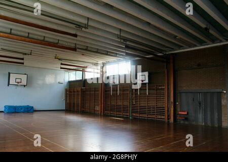 an empty classic wooden style gymnasium in an english secondary school in london england UK Stock Photo