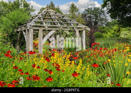 A wooden pagoda in the colourful 'Hot Garden' at Wollerton Old Hall Gardens, Wollerton, Market Drayton, Shropshire, England, UK Stock Photo