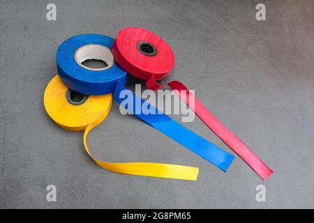 Three rolls of electrical tape for repair and bonding of wires and other types of work Stock Photo