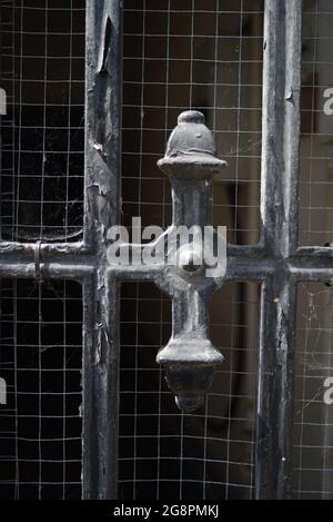 Iron bar gate fence painted black Stock Photo