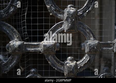 Iron link gate with square wire mesh Stock Photo