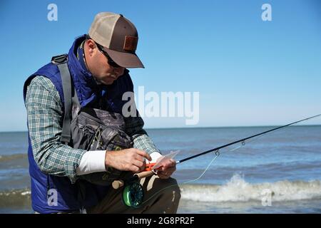 Selecting fly pattern for fly fishing Stock Photo