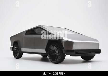 Izmir, Turkey - March  23, 2021: Tesla brand cybertruck pickup car on a white background with headlights on. Stock Photo