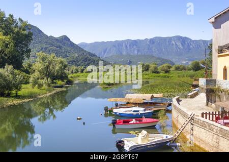 Virpazar, Montenegro - July 4, 2014: Beautiful view of Lake Skadar and tourists boats. Stock Photo