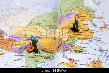 Delivery Models over the world map book. Stock Photo