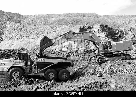 JOHANNESBURG, SOUTH AFRICA - Jan 06, 2021: A excavator working in the pit manganese mining site Stock Photo