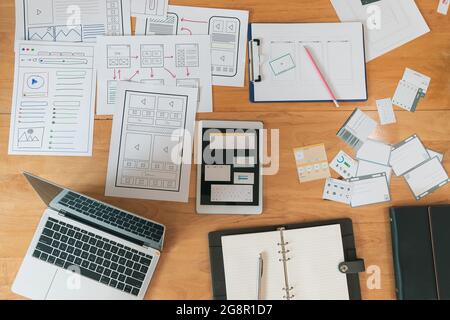 Top view of Creative flat lay UX designer working space and office supplies. Smartphone and tablet application layout prototype project. Stock Photo