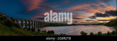 The Royal Border Bridge beside the remains of the Edward I town wall looking up the Tweed from Tommy the Millers Field, Berwick upon Tweed, England Stock Photo