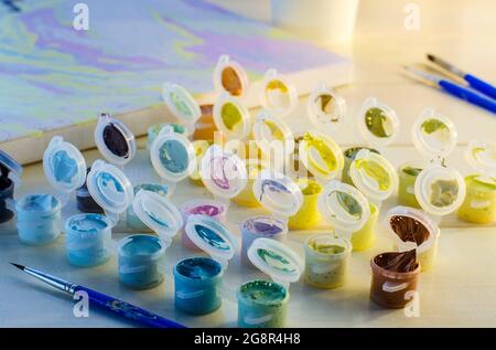 set of colored acrylic paints and brushes for drawing Stock Photo