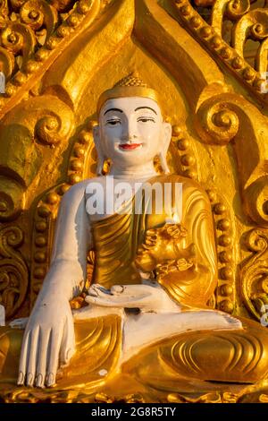 Kyaik Tan Lan or Kyaikthanlan Pagoda in Mawlamyine, seated Buddha in golden robe Stock Photo