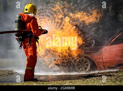 A firefighter operates a water hose during the Major Accident