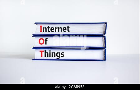 IOT, internet of things symbol. Books with words IOT, internet of things on beautiful white background. Business, digital, IOT, internet of things con Stock Photo