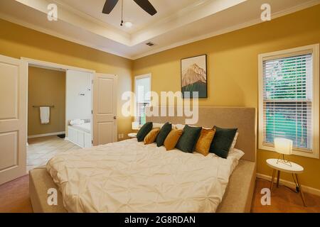 An inviting and comfortable master bedroom and en suite. Why stay at a hotel when you get this much comfort with a vacation rental. Stock Photo