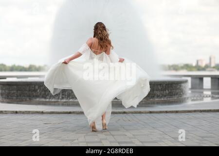 A person standing in front of water Stock Photo