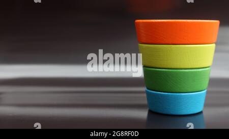 inverted multicolor child's pyramid on black background Stock Photo