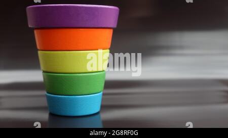 inverted multicolor child's pyramid on black background Stock Photo