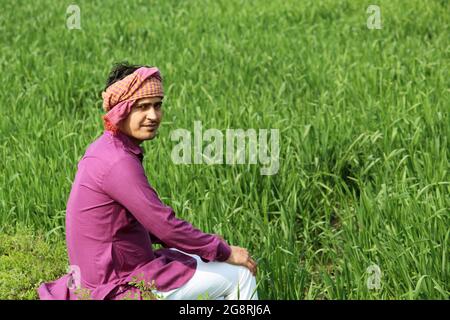 indian farmer talking phone,agricultral field Stock Photo