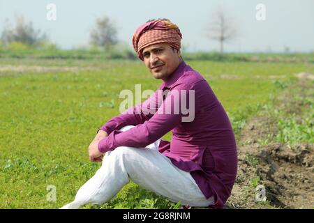 indian farmer talking phone,agricultral field Stock Photo