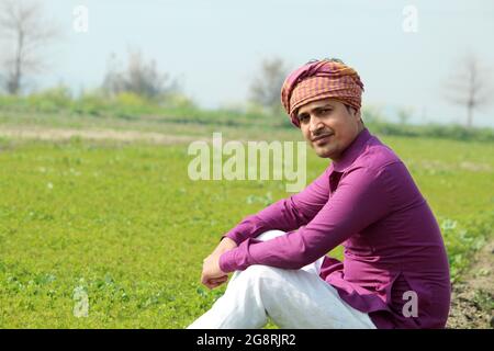 indian farmer talking phone,agricultral field Stock Photo