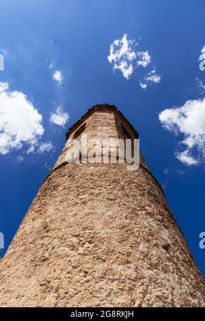 The Medieval Tower of San Felipe. Low angle view against blue sky. Brihuega, Guadalajara Stock Photo