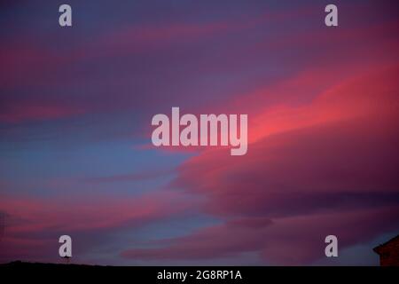 sunset skies with warm colors in summer times Stock Photo