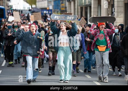 Bath, UK. 27th March 2021. Approximately 200 mostly young protesters took to the streets of historic Bath in North Somerset to demonstrate against the police & crime bill. The group of demonstrators initially gathered at Bath Abbey before marching through the streets of the city centre shouting “kill the bill” and “who's streets, our streets”. A small number of police accompanied the march which went ahead peacefully and without incident.