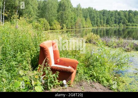 Red chair on a green background 21 Stock Photo