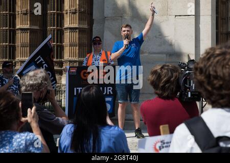 London, UK. 20th July, 2021. Matthew Tovey, a NHS Wales nurse from Merthyr Tydfil, addresses fellow NHS workers from the grassroots NHSPay15 campaign outside Parliament before a march to 10 Downing Street to present his petition signed by over 800,000 people calling for a 15% pay rise for NHS workers. At the time of presentation of the petition, the government was believed to be preparing to offer NHS workers a 3% pay rise in 'recognition of the unique impact of the pandemic on the NHS'. Credit: Mark Kerrison/Alamy Live News Stock Photo