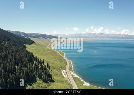 Lake and grassland with a sunny day. Shot in Sayram Lake, Xinjiang, China. Stock Photo