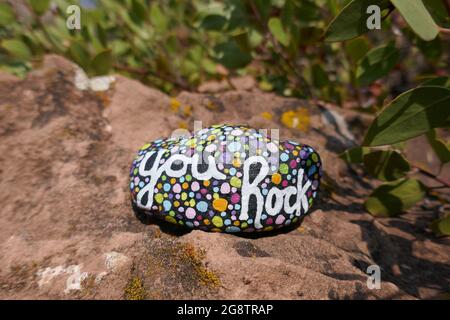 Kindness rock with painted you rock message on large rock Stock Photo