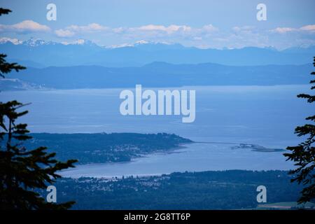 Looking down on Courtenay and Comox from Forbidden Plateau on Vancouver Island, BC.  Across Georgia Strait lies Texada Island and BC Mainland Stock Photo