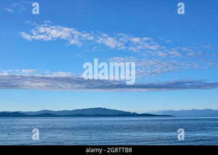 Many shades of blue:  Looking across Georgia Strait from Rathtrevor Provincial Park on Vancouver Island to islands of Texada and Lasqueti. Stock Photo