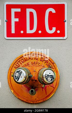 A fire department connection automatic sprinkler system is installed on the wall of Starbucks, July 18, 2021, in Mobile, Alabama. Stock Photo