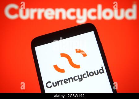 Ukraine. 22nd July, 2021. In this photo illustration a Currencycloud logo is seen on a smartphone and a pc screen. (Photo by Pavlo Gonchar/SOPA Images/Sipa USA) Credit: Sipa USA/Alamy Live News Stock Photo