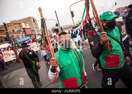 July 20, 2020, BogotÃ, Colombia: Members of the indigenous guard march along one of the points of resistance in the capital.The indigenous guard arrives in BogotÃ on July 20th, Colombia's Independence Day, to support the protests. The day began with a press conference in front of the CRIC (Cauca Regional Indigenous Council), where also members of the frontline participated, during the day two traditional buses, that the indigenous groups used for transport drove all over the resistance points of the capital, where the protests were taking place. (Credit Image: © Antonio Cascio/SOPA Images via Stock Photo