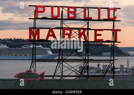 Seattle, USA. 21 Jul, 2021. Royal Caribbean Ovation of the Seas cruise ship and the Pike Place Market neon sign. Stock Photo