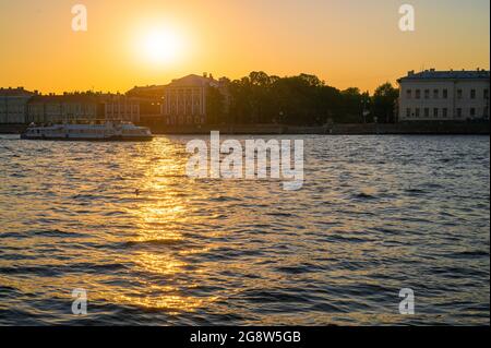 Evening Saint-Petersburg. Cities of Russia. Beautiful sunset over Petersburg. Aerial view of the Vasilievsky island and the Neva river. Stock Photo