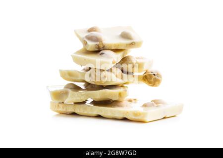 White nutty chocolate with hazelnuts isolated on white background. Stock Photo