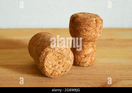 Two champagne corks on a wooden table. Close-up. Macro Stock Photo