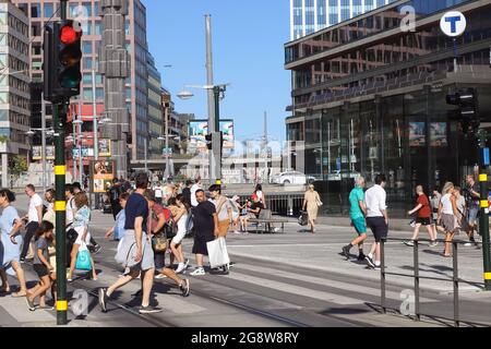 Stockholm, Sweden - July 21, 2021: People at Drottninggatan crosswalk near the Sergels torg square in the downtown district. Stock Photo