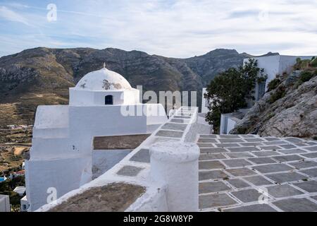 Church orthodox, small whitewashed old chapel, climbed on rocky mountain at Serifos island, Cyclades Greece. Religious destination vacation summer Stock Photo
