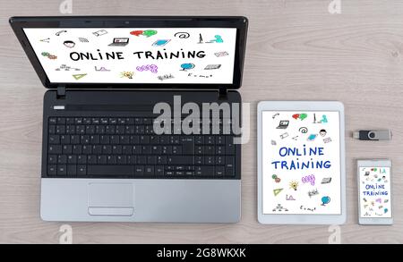 Online training concept shown on different information technology devices Stock Photo