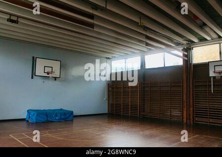 an empty classic wooden style gymnasium in an english secondary school in london england UK Stock Photo