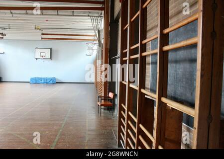 an empty classic wooden style gymnasium in an english secondary school in london england UK Stock Photo