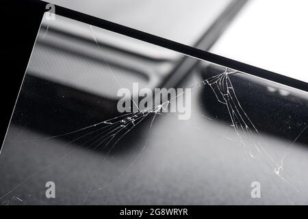 closeup broken tempered glass screen protector for smartphone. Stock Photo