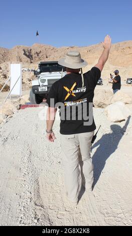 A 4x4 vehicle negotiates the Drum Shake off-road obstacle at 'XQuarry' Off-Road and Adventure Park in Mleiha desert, Sharjah, United Arab Emirates. Stock Photo