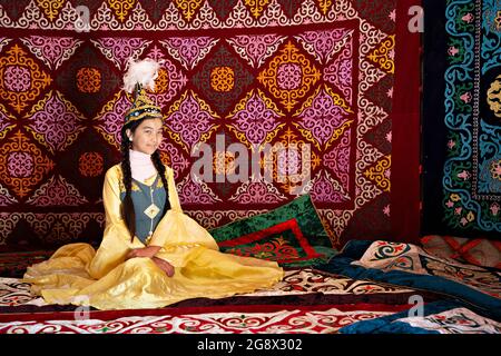 Kazakh girl in traditional clothes near Almaty, Kazakhstan Stock Photo